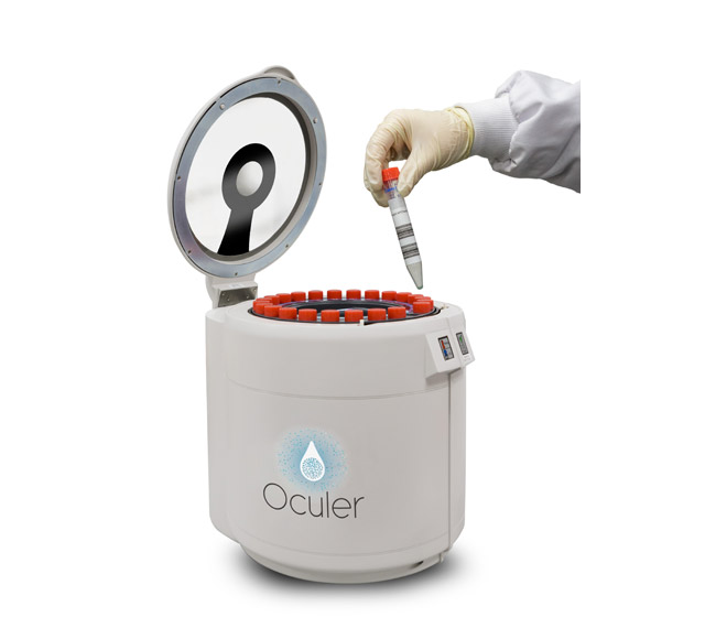 A hand inserting a vial into the Oculer validation system